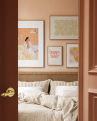 Peachy bedroom gallery wall